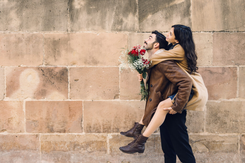 woman-sitting-on-back-of-man